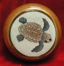 Stitches used: Whole and Three-quarter Cross Stitch, and Backstitch.
